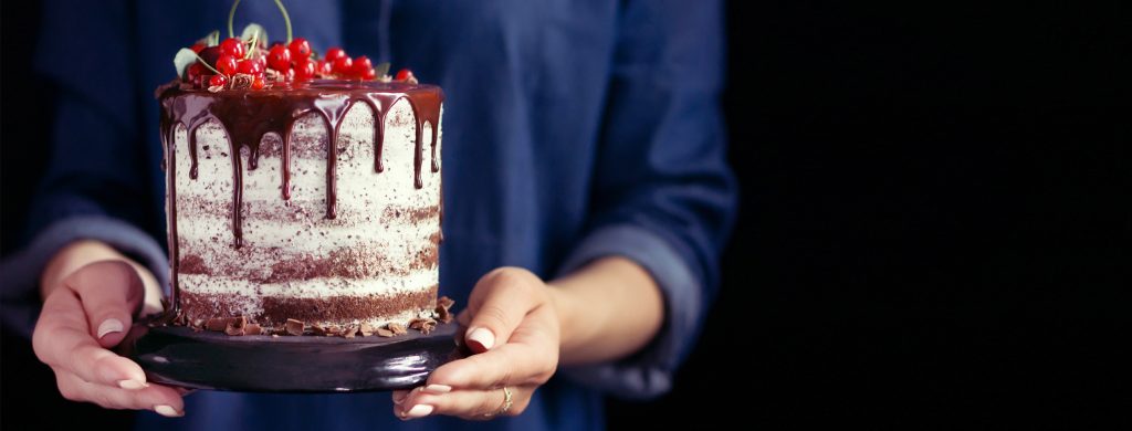 chocolate cake hands holding